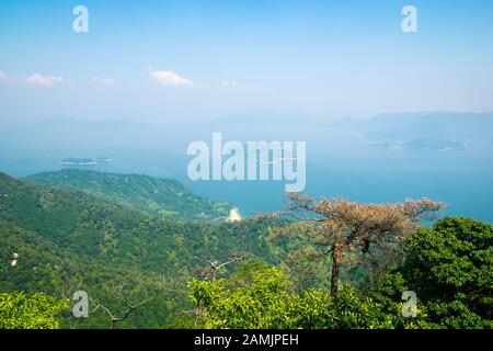 A view of Seto Inland Sea on a hazy summer day from the Shishiiwa Observatory on Mount Misen, Miyajima Island (Itsukushima), Japan. Stock Photo