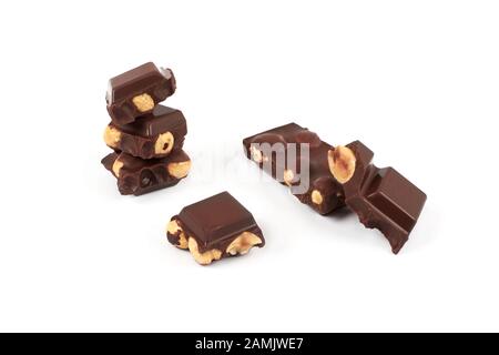 Chocolate pieces with nuts isolated on white background Stock Photo