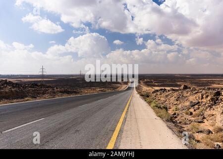 Desert Road, Desert highway, route 5, in basalt gravel desert, near Azraq, eastern desert, Jordan, middle east, Asia Stock Photo
