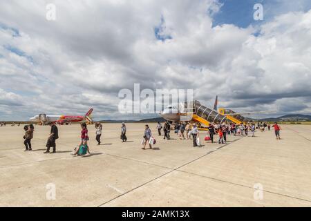 Da Lat, Vietnam - January 23, 2018: People are leaving a plane that has just landed Stock Photo
