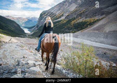 Horseback riding in Lake Louise, Banff National Park, Canadian Rockies Stock Photo