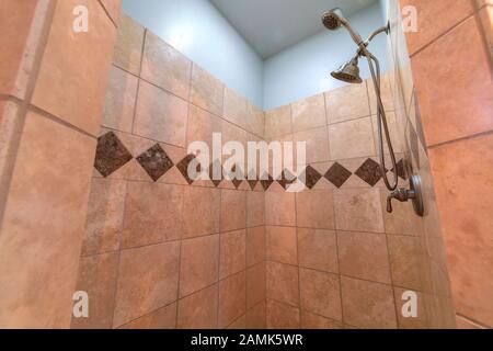 Tiled shower with decorative diamond pattern bright interior Stock Photo