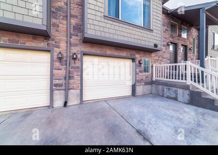 Double garages below a residential house day light Stock Photo