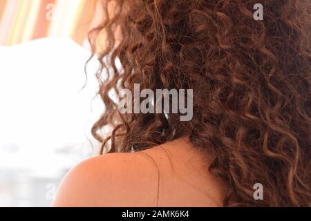 step cut hairstyle for curly hair back view