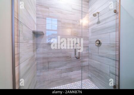 Large modern tiled shower cubicle bright interior Stock Photo