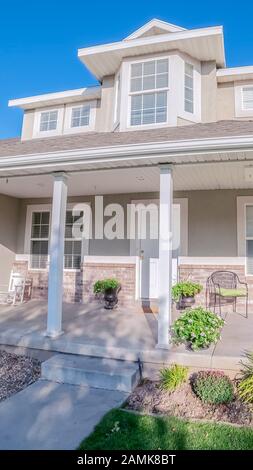 Vertical Covered porch at the front of an urban house Stock Photo - Alamy