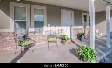 Panorama frame Front porch and door of house with stone pillars Stock ...