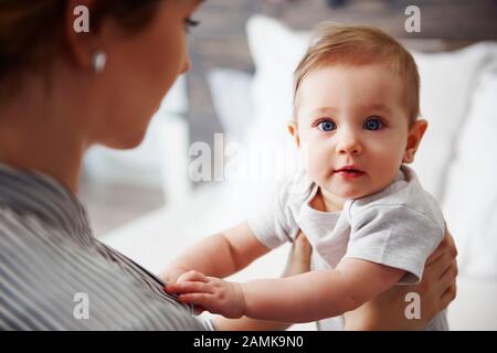 Portrait of confused baby looking at camera Stock Photo