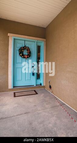 Vertical Colorful bright blue front door to a home Stock Photo