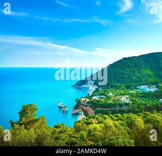 Mattinata Faraglioni stacks and beach coast of Mergoli, Vieste Gargano, Apulia, Italy. Europe. Long Exposure Stock Photo