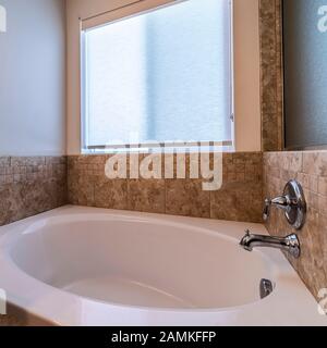 Square frame Small compact spa bath or jacuzzi day light Stock Photo