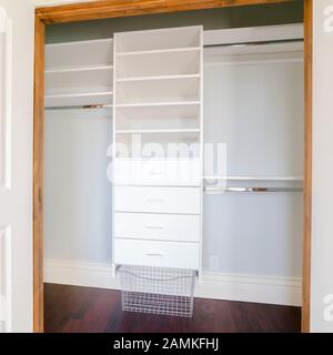Square frame Empty shelves of a luxury walk-in closet Stock Photo