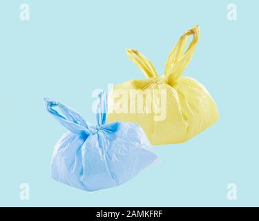 Tie up sweet color plastic bags on background isolate, Ecology Concept.Flat lay.Top view.Banner Stock Photo