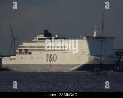 Yacht Cat Zero on The River Humber estuary near the P and O North Sea Ferry 'Pride of Rotterdam' at her berth near King George Dock in east Hull, UK Stock Photo