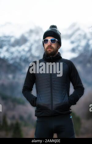 Man with beard mountaineer portrait only the mountains Stock Photo
