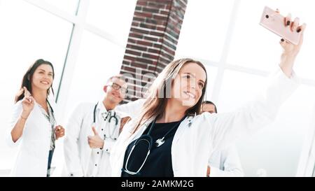 smiling team of doctors at the medical center taking a selfie Stock Photo