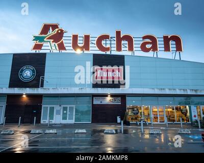 Calais, France - January 14, 2020 :  Auchan hypermarket. Auchan is a French international supermarket chain, is one of the largest distribution groups Stock Photo