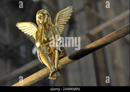 Golden guardian angels sit on the scaffolding in the Heilig Kreuz Kirche on Giesinger Berg, which is currently being renovated. [automated translation] Stock Photo