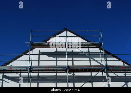 Scaffolding on the gable of a newly built detached house in Emmering. [automated translation] Stock Photo