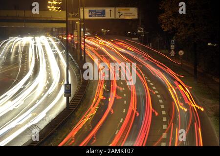 Light tracks of vehicles on the Mittlerer Ring in Giesing at night. [automated translation] Stock Photo