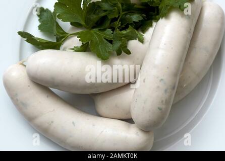Bavarian snack: white sausage garnished with parsley. [automated translation] Stock Photo