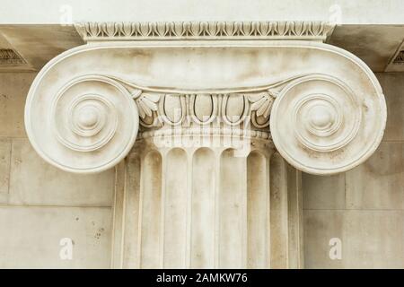 Decorative detail of an ancient Ionic column. close up. Stock Photo