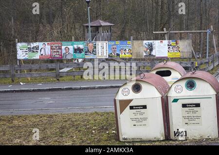 Wooden boards with election posters on the fence of a children's playground in Miesbach. The posters with the affair-ridden Miesbach District Administrator Jakob Kreidl (CSU) have been taken down. In the foreground bottle bank. [automated translation] Stock Photo