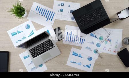 Two corporate laptops in big office, work on business project, top view Stock Photo