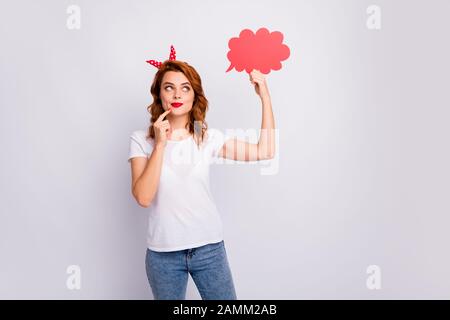 Portrait of her she nice-looking attractive lovely pretty cheerful cheery curious girl holding in hand paper cloud creating idea isolated over light Stock Photo