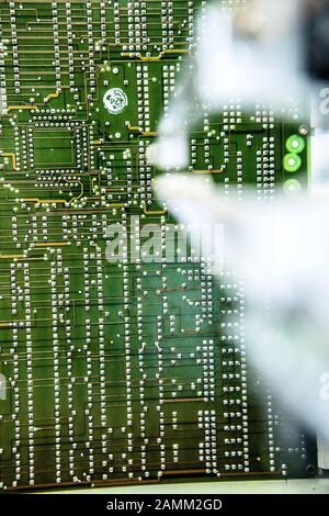 The electronics of passenger trains are checked and, if necessary, repaired at the new Electronic Central Works Munich (EZW) of the Bahn subsidiary Fahrzeuginstandhaltung GmbH at Bertha-Kipfmüller-Straße 48 in Neuaubing. In the picture all components of a board are tested in the ITC tester [automated translation] Stock Photo
