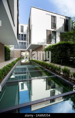 Newly built luxury apartments with swimming pool under glass in a backyard in Munich's Gärtnerplatz quarter. [automated translation] Stock Photo