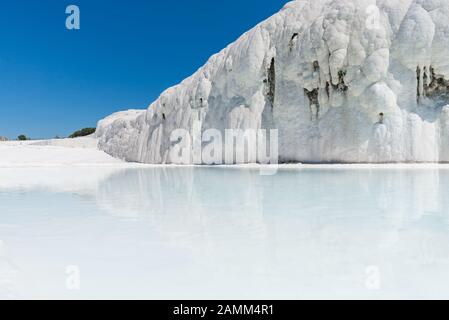 Natural travertine pools and terraces at Pamukkale ,Turkey. Pamukkale, meaning cotton castle in Turkish,Turkey Stock Photo