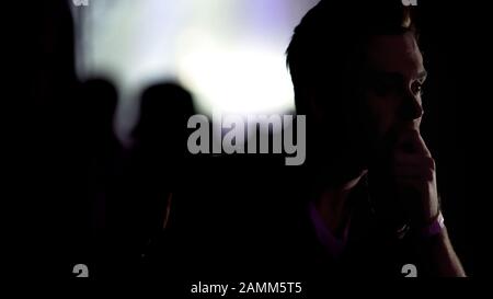 Young man pondering over problems, reflecting on past, 30s crisis depression Stock Photo