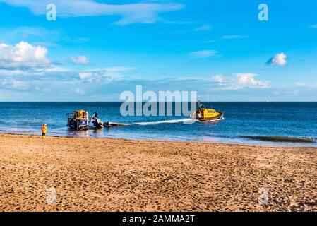 EXMOUTH, DEVON, UK - 3APR2019: RNLB R & J Welburn, a Shannon Class lifeboat, launching from Exmouth Beach  on a regular exercise. Stock Photo