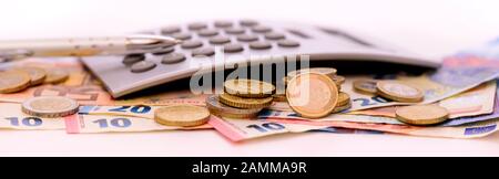 Euro banknotes and calculator [automated translation] Stock Photo