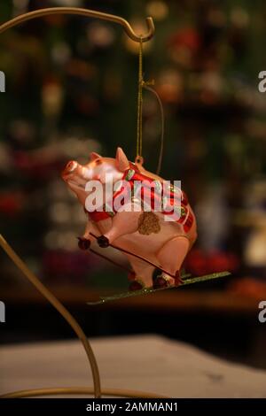 Unusual Christmas tree pendants in a cellar studio in the Westend. In the picture a skier pig. [automated translation] Stock Photo