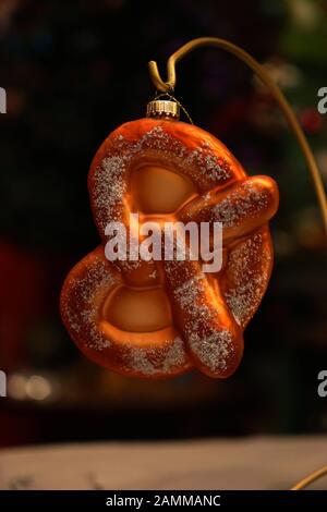 Unusual Christmas tree pendants in a cellar studio in the Westend. The picture shows a pretzel. [automated translation] Stock Photo