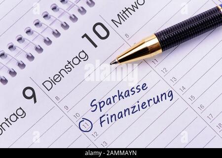 Savings bank and financing as entries in the diary [automated translation] Stock Photo