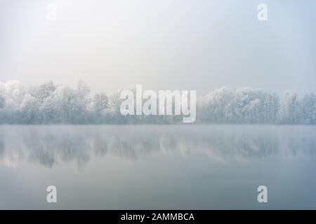 Hoarfrost covers the trees near the Mühlsee in Neufahrn. [automated translation] Stock Photo