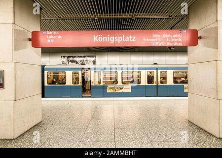 Passengers and underground train at the underground station Königsplatz. [automated translation] Stock Photo