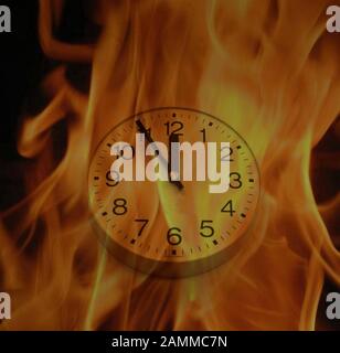 burning clock at 5 to 12. [automated translation] Stock Photo