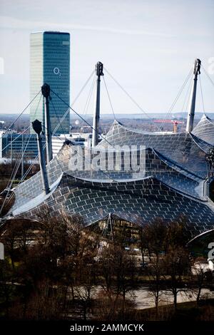 Spring in Munich's Olympic Park: the picture shows the view from the Olympic Mountain to the Olympic Stadium and the O2 high-rise building. [automated translation] Stock Photo