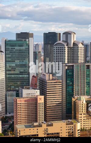 OSAKA, JAPAN - OCTOBER 15, 2019: The view from the Umeda Sky Building Observatory to the skyscraper center with Herbis Plaza in front of JR Osaka Stat Stock Photo