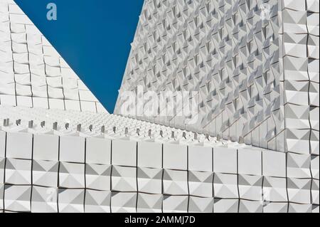 The newly built Catholic parish church Seliger Pater Rupert Mayer in Poing (architect: Andreas Meck). The façade consists of white ceramic tiles glistening in the sun. [automated translation] Stock Photo