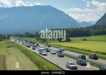 heavy to slow-moving traffic on the A8 motorway in both directions with the Untersberg in the background - designated as the gateway to Berchtesgadener Land View towards Salzburg and towards Munich [automated translation] Stock Photo