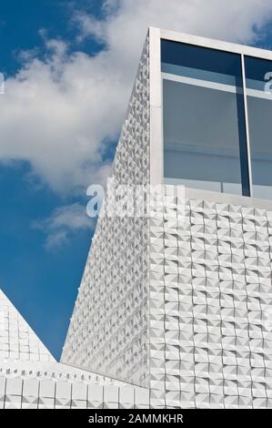 The newly built Catholic parish church Seliger Pater Rupert Mayer in Poing (architect: Andreas Meck). The façade consists of white ceramic tiles glistening in the sun. [automated translation] Stock Photo