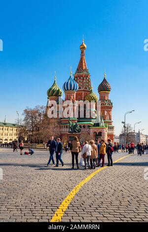 Moscow, Russia-April 14, 2018: Tourists at Saint Basil Cathedral in Red Square at Moscow,Russia. Stock Photo