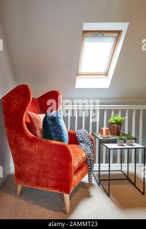 orange chair on landing Stock Photo