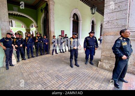 Police watch protest rally. Merida, Mexico. Stock Photo