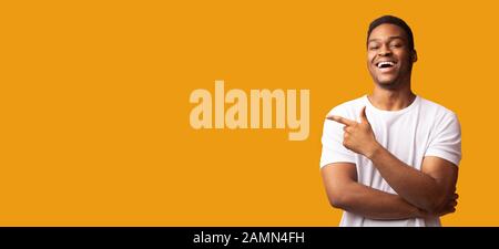 African american man pointing aside at empty space Stock Photo